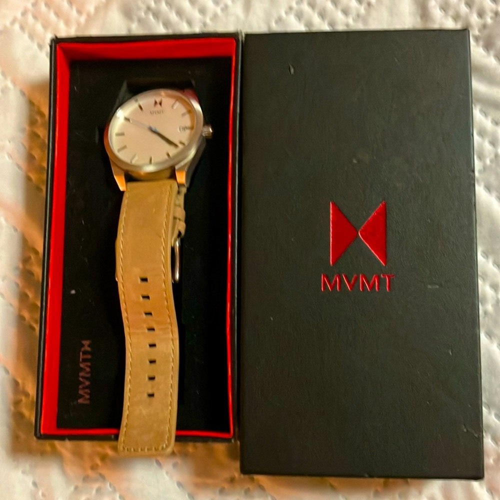 MVMTwatch, very sharp only worn once beige band with a white face